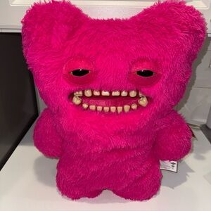 Bright Pink Plush Monster Toy with Expressive Face